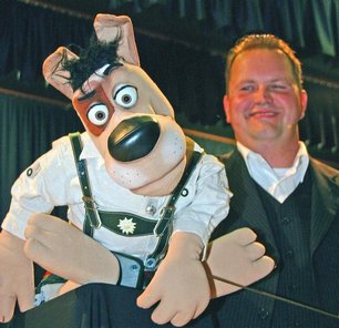Performer Christoph Quernheim with customized WOLF puppet.